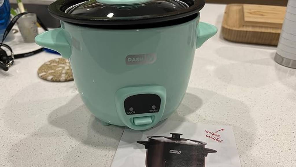 Stylish lavender edition Dash mini rice cooker in modern kitchen setting.